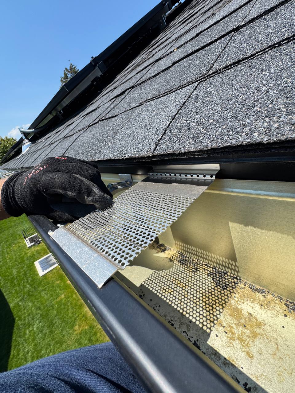 Close-up of gutter guard service
